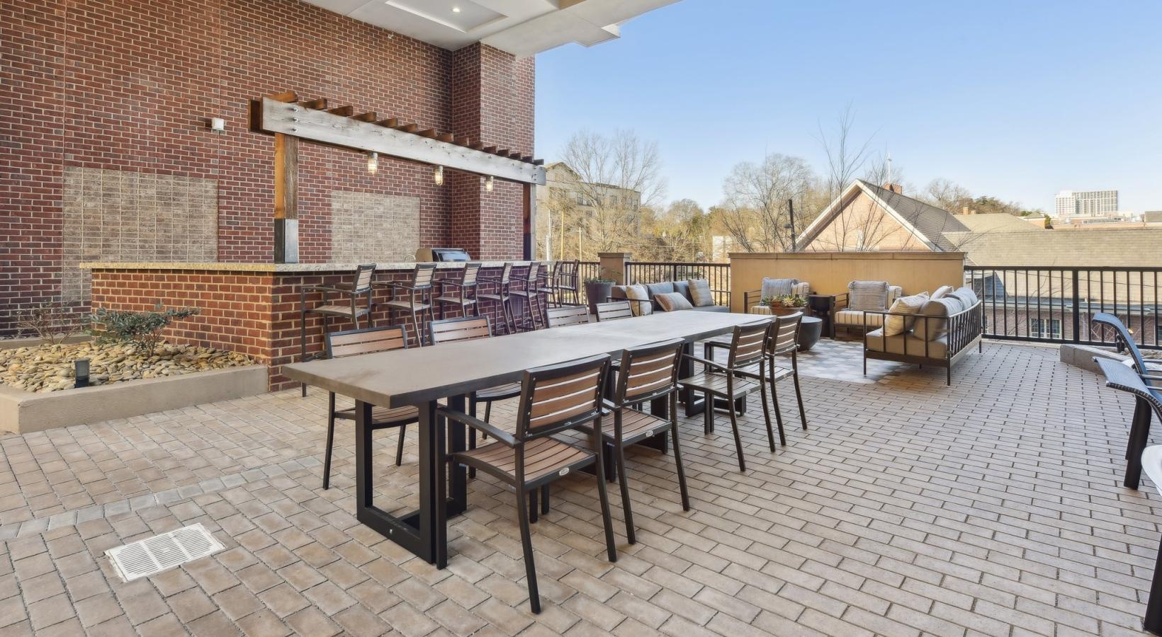 The essence of exceptional living a table and chairs outside