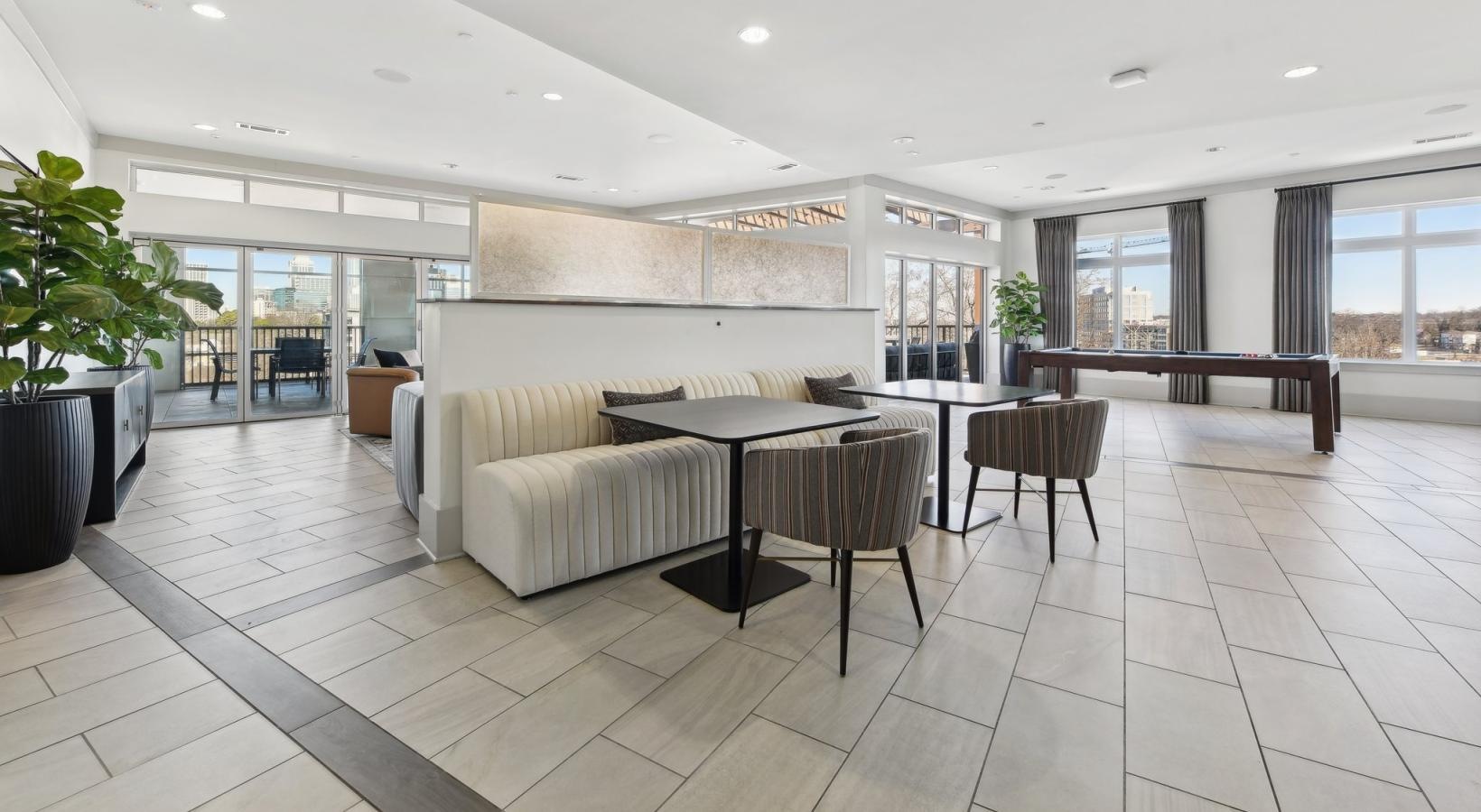 The essence of exceptional living a large room with a large table and chairs