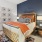 a bedroom with a bed and shelves