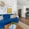a living room with a blue couch