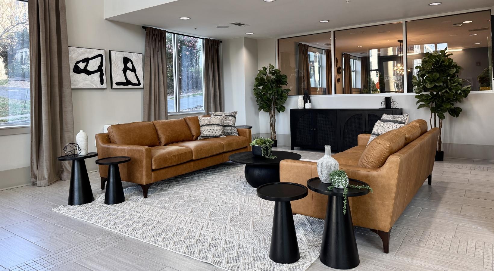 Settle into comfort at Lincoln at Dilworth a living room with a couch and a coffee table