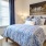 a bedroom with a bed and a lamp