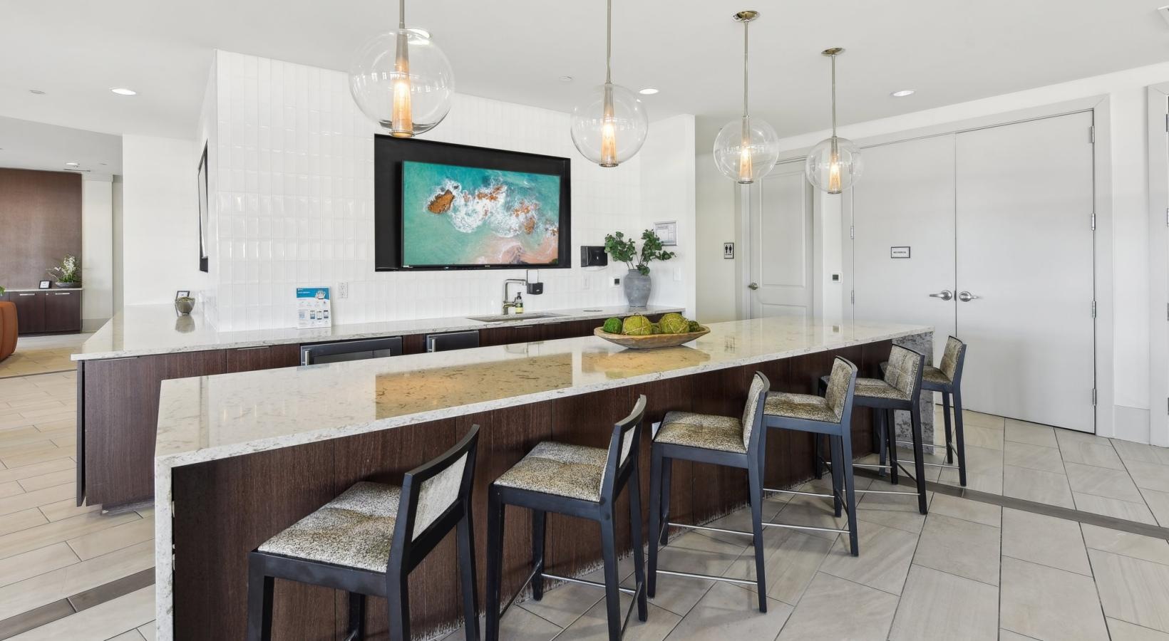 Settle into comfort at Lincoln at Dilworth a kitchen with a large table and chairs