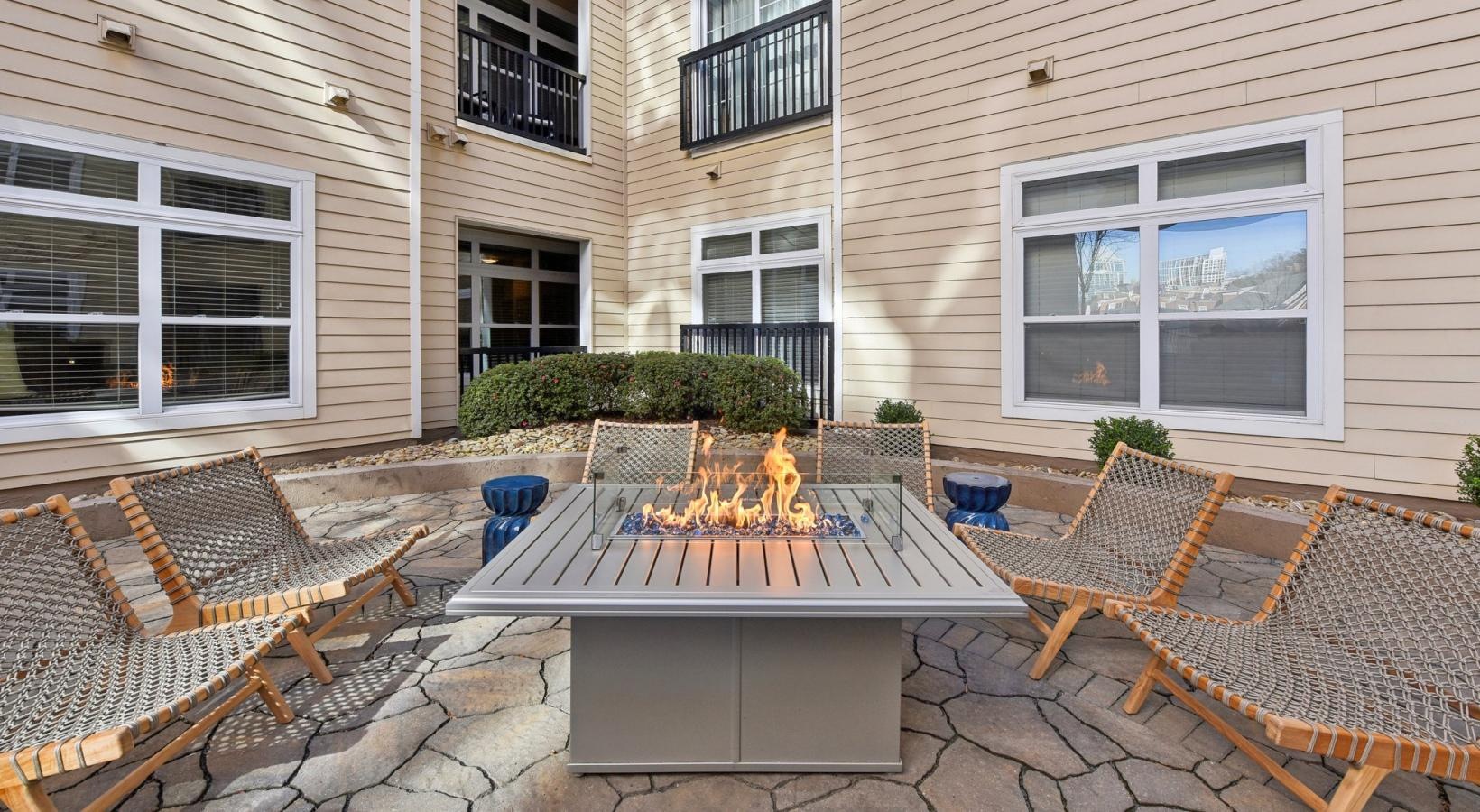 The essence of exceptional living a fire pit in front of a building