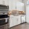 a kitchen with white cabinets