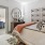 a bedroom with a bed and a mirror