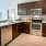 a kitchen with wooden cabinets