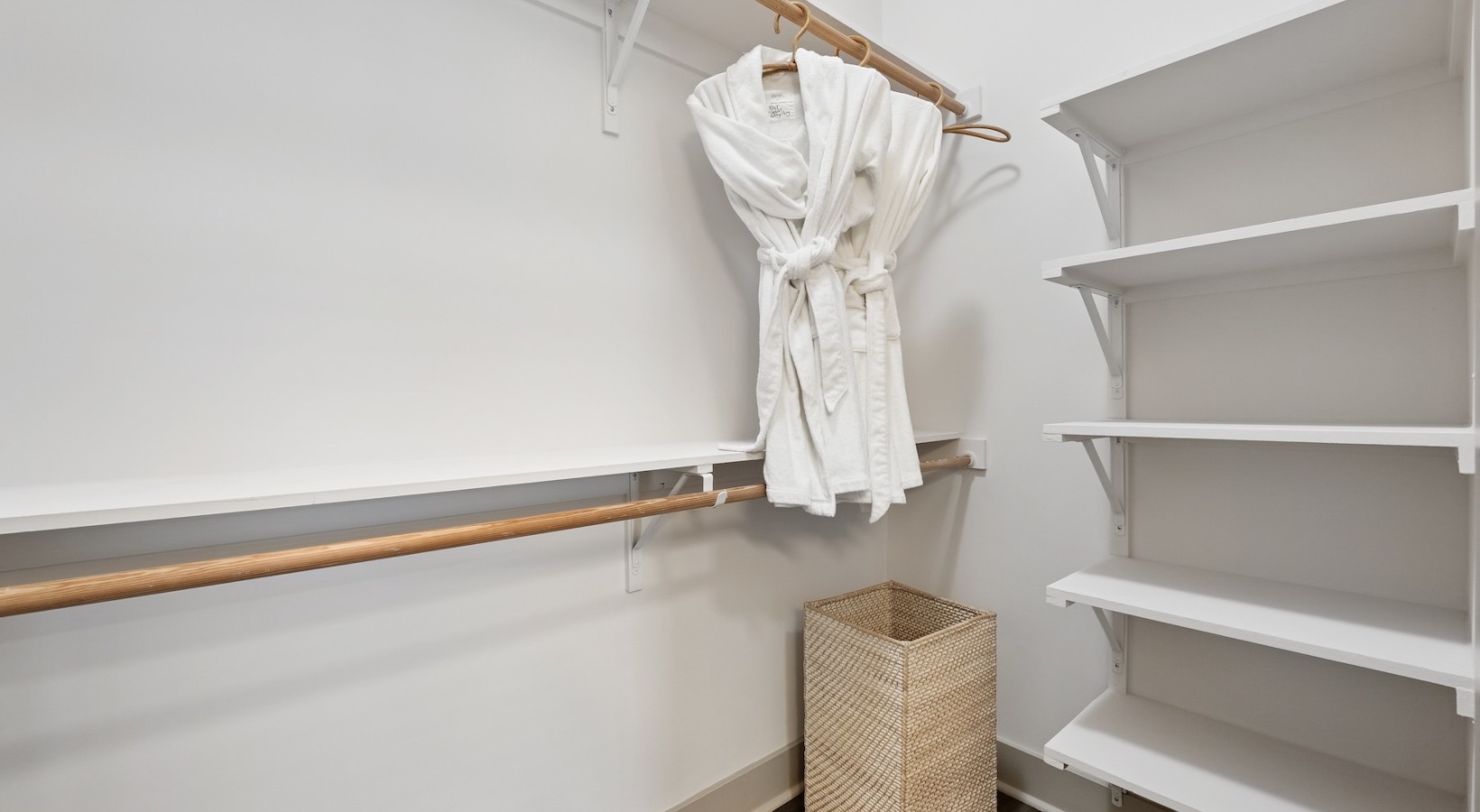 All the comforts of luxury living well lit walk-in closet