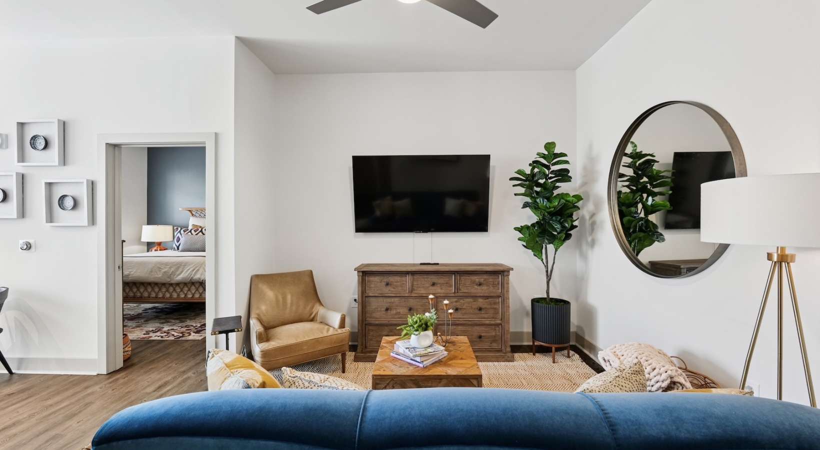 Gorgeous living areas to entertain and enjoy living room with blue couch and ceiling fan