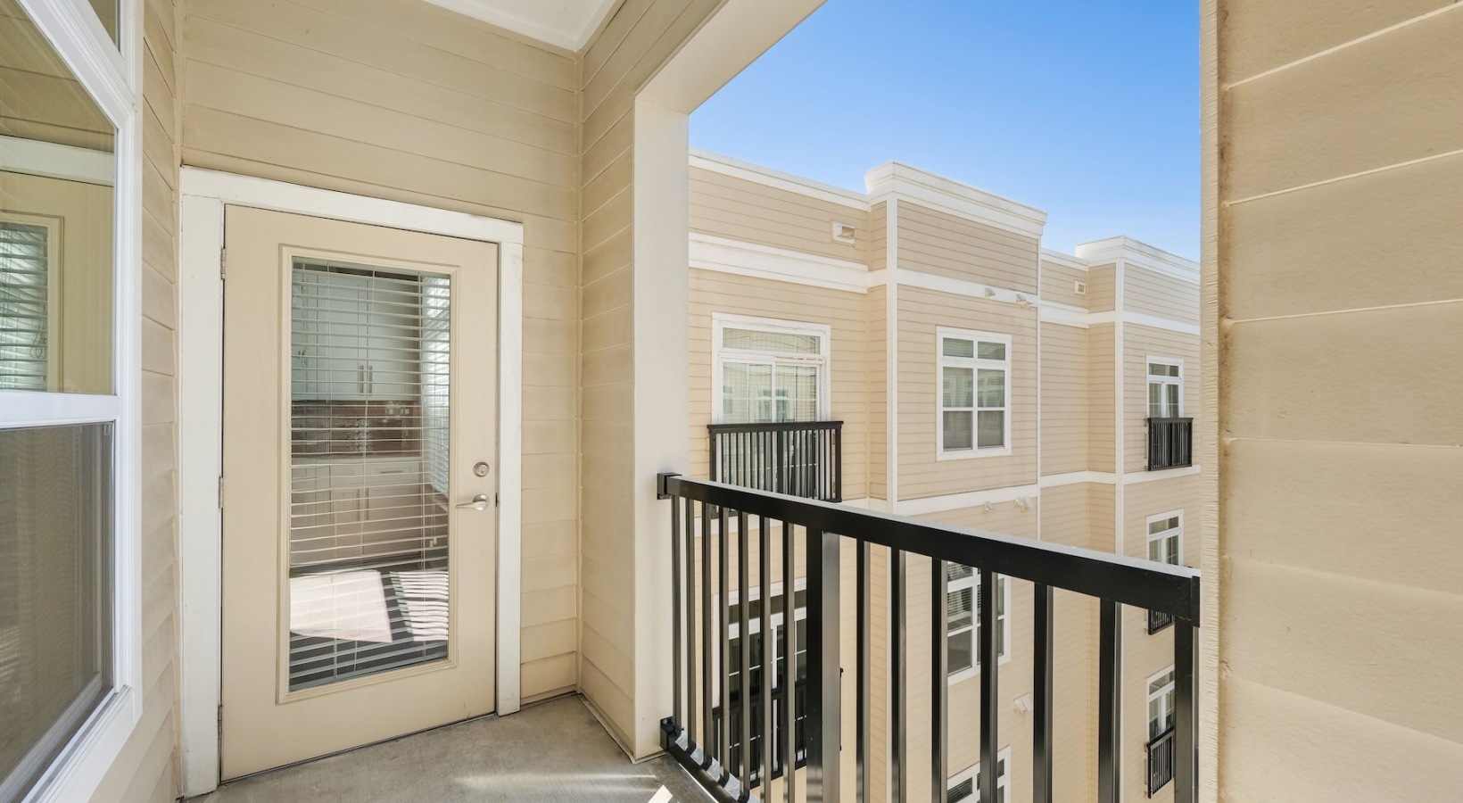 Spacious balconies patio with apartment views